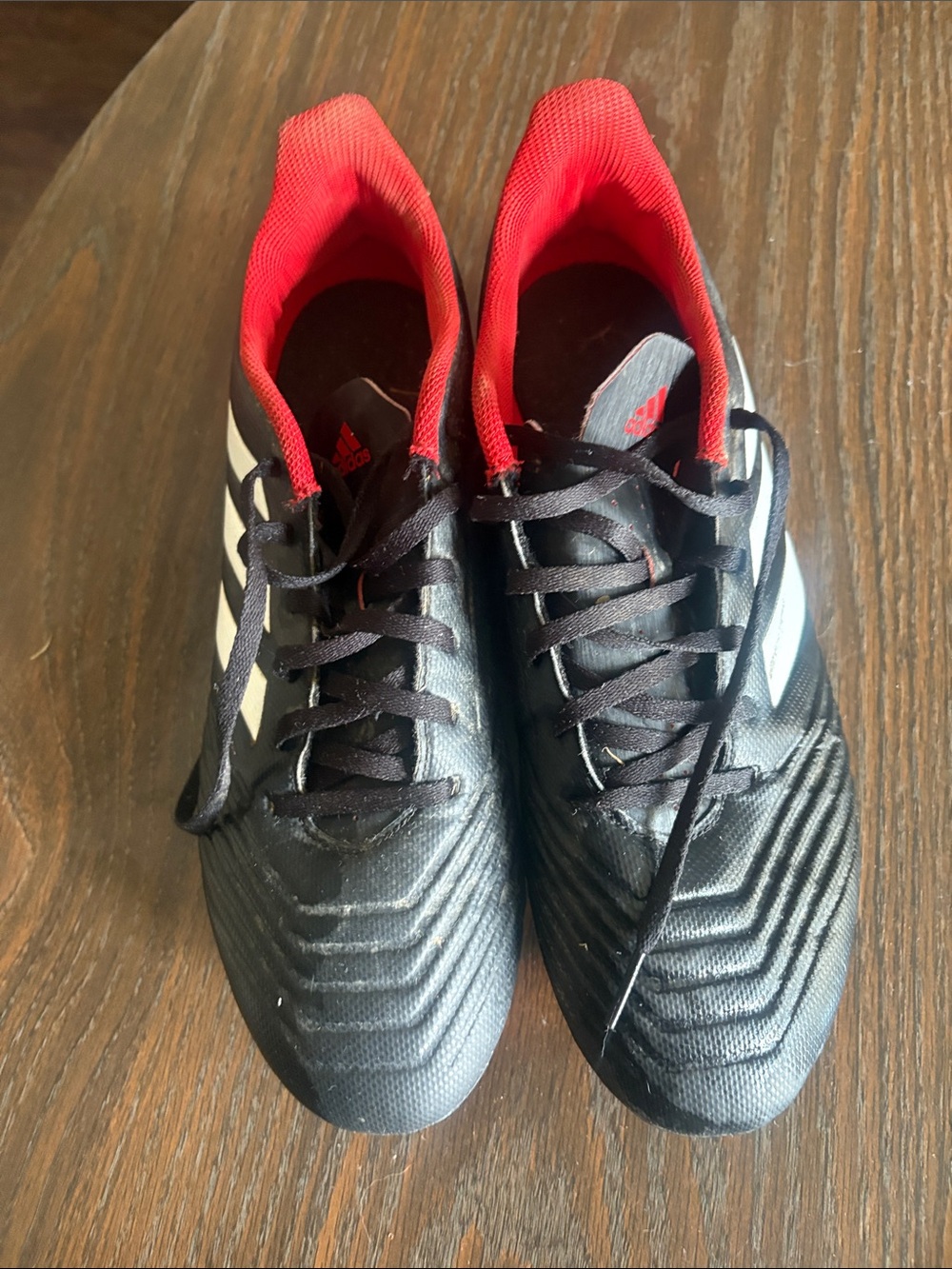 adidas Men’s Black Soccer Shoes with Red Lining and White Stripes
